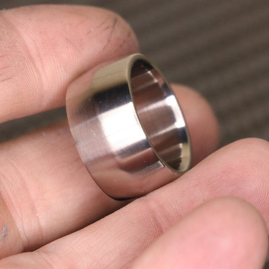 Edge profile broad titanium ring by carbon fi